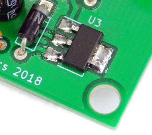 Surface mount regulator soldered in place